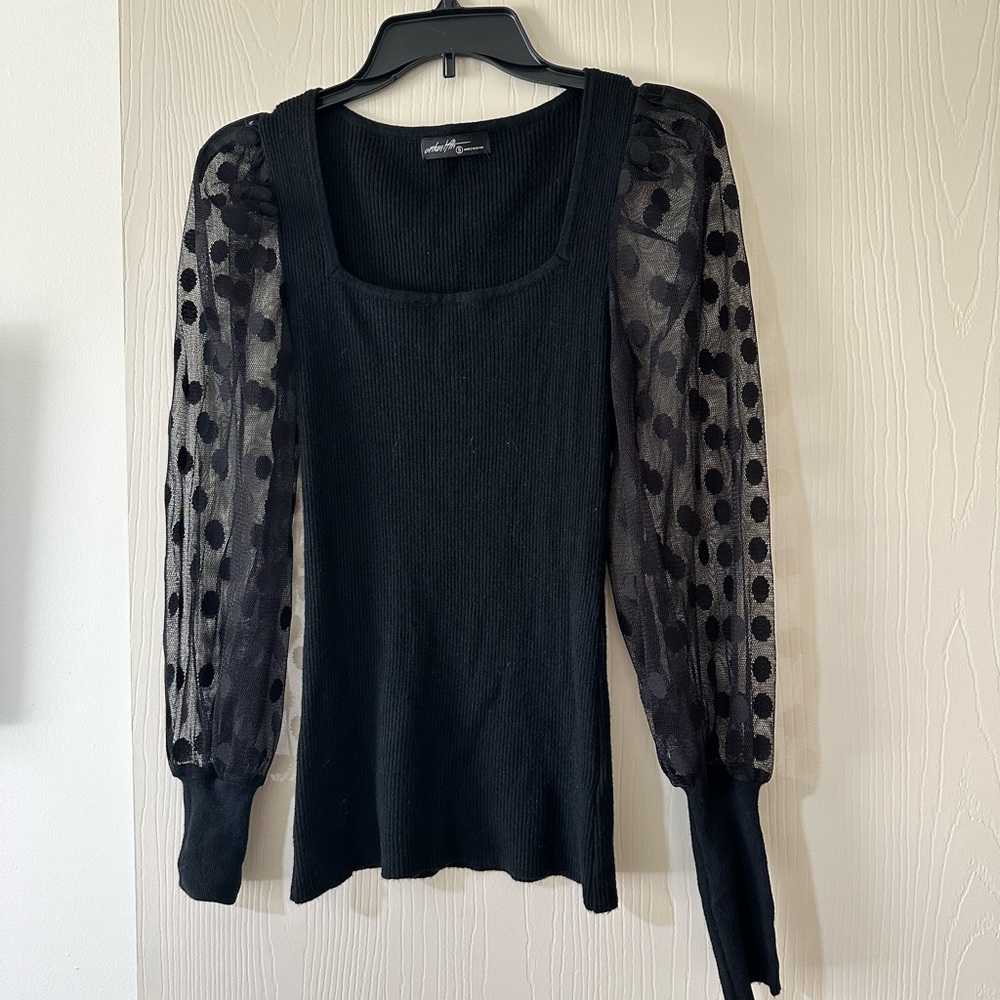 Elegant Black Top with Sheer Polka Dot Sleeves